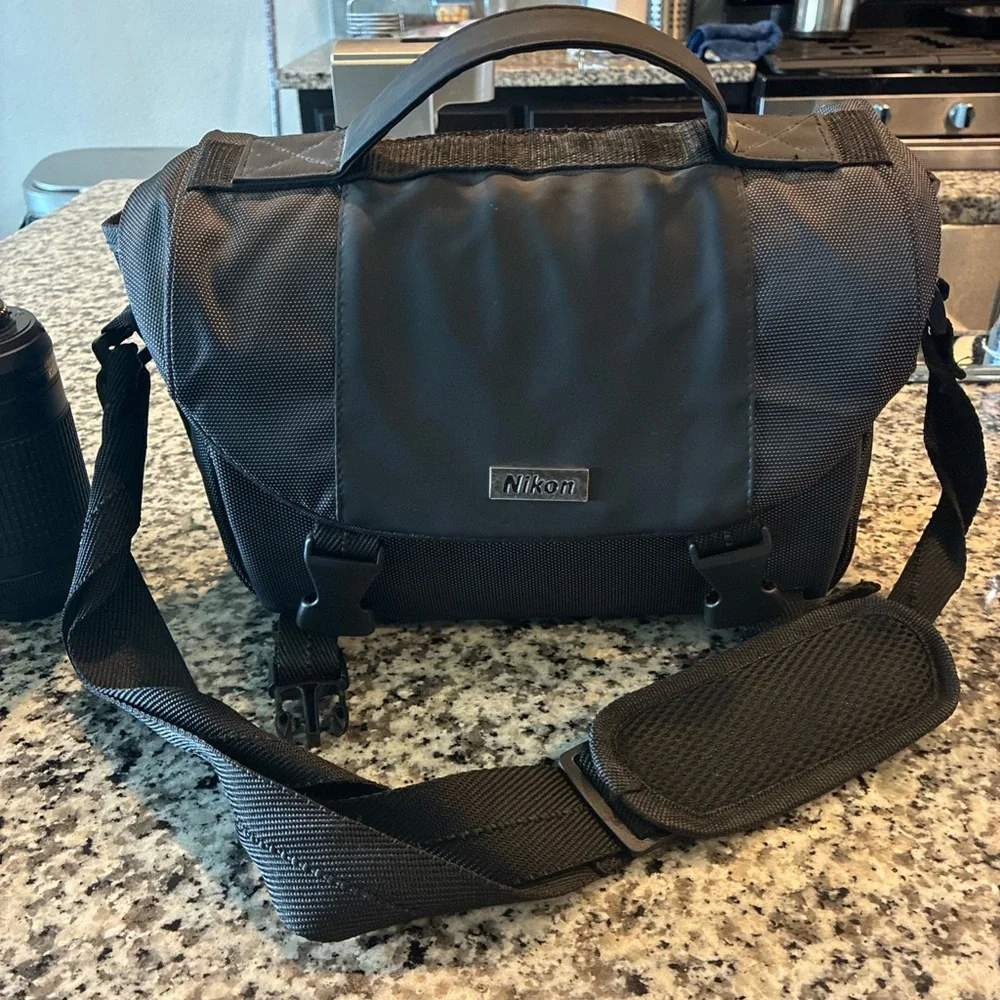 Nikon Black Digital Camera with Ergonomic Design and Professional Lens